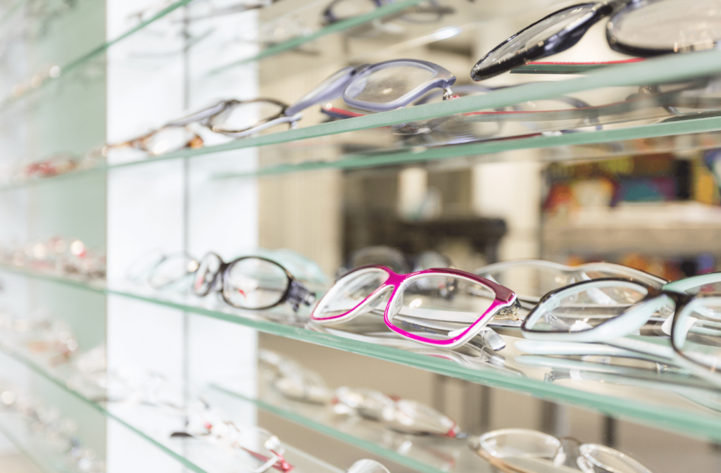 Several pairs of glasses on display at an optometrist office